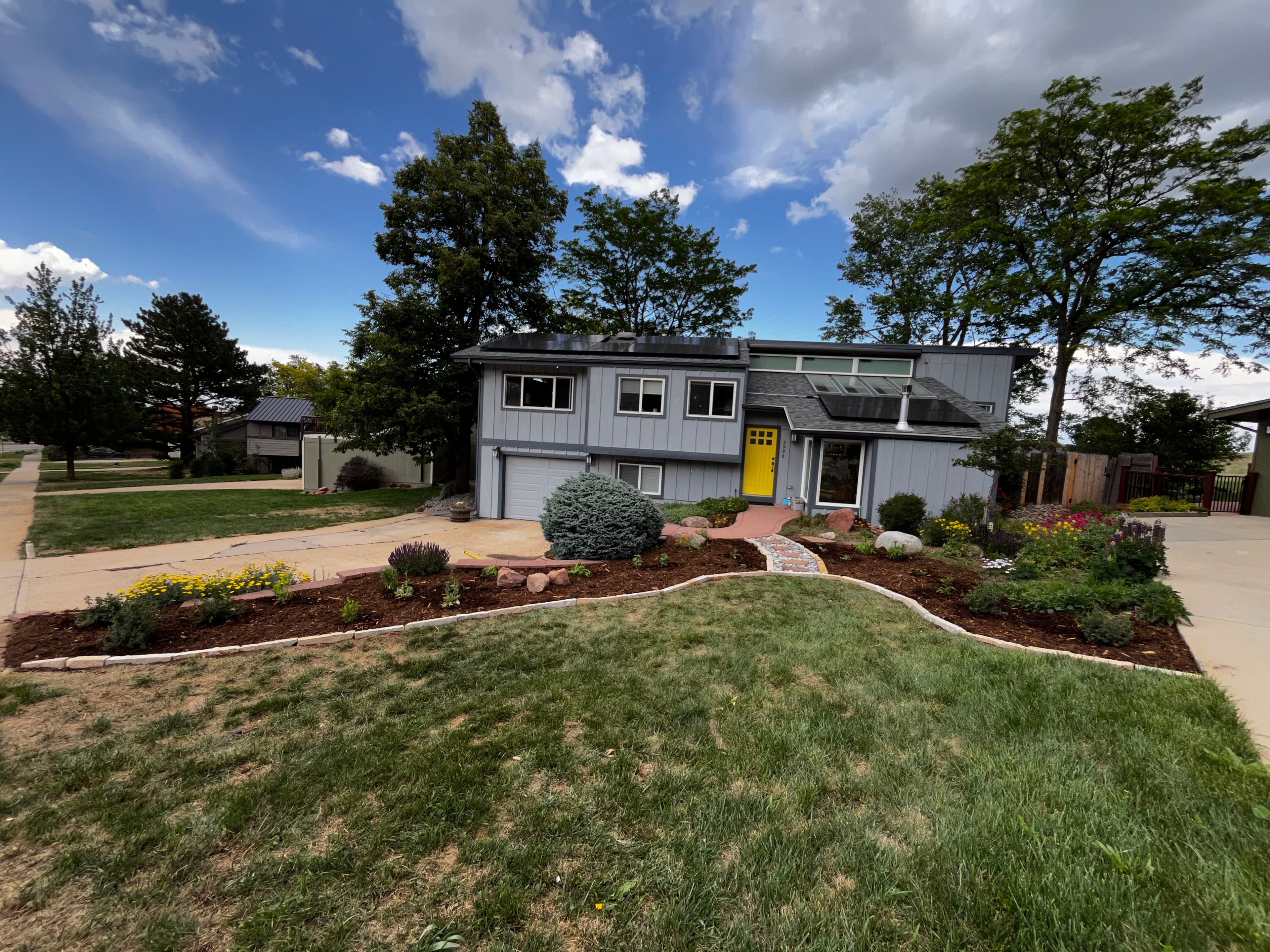 Project Lawn Reduction Done Right - Native Perennials, Boulders, and Zero Wasted Water image
